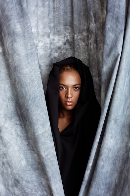 Beyoncé Embraces Church Girl Aesthetic in a Bespoke Hooded Black Mini Dress by Carolina Herrera