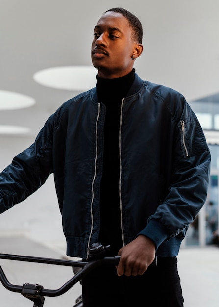Aaron Pierre, Voice of Mufasa, Sports a Sleek Paul Smith Navy Leather Jacket on The Jennifer Hudson Show